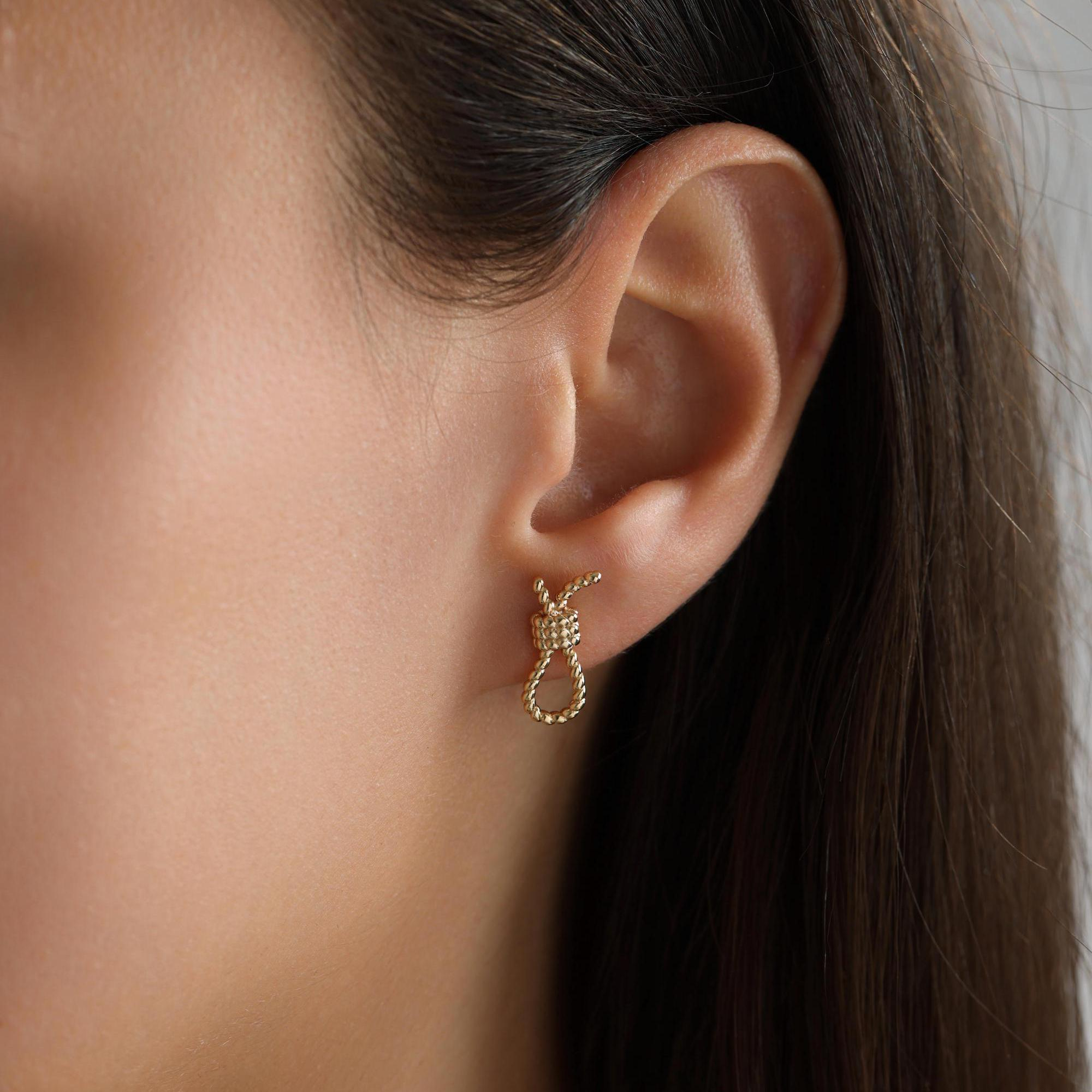 Delicate brass bow earrings